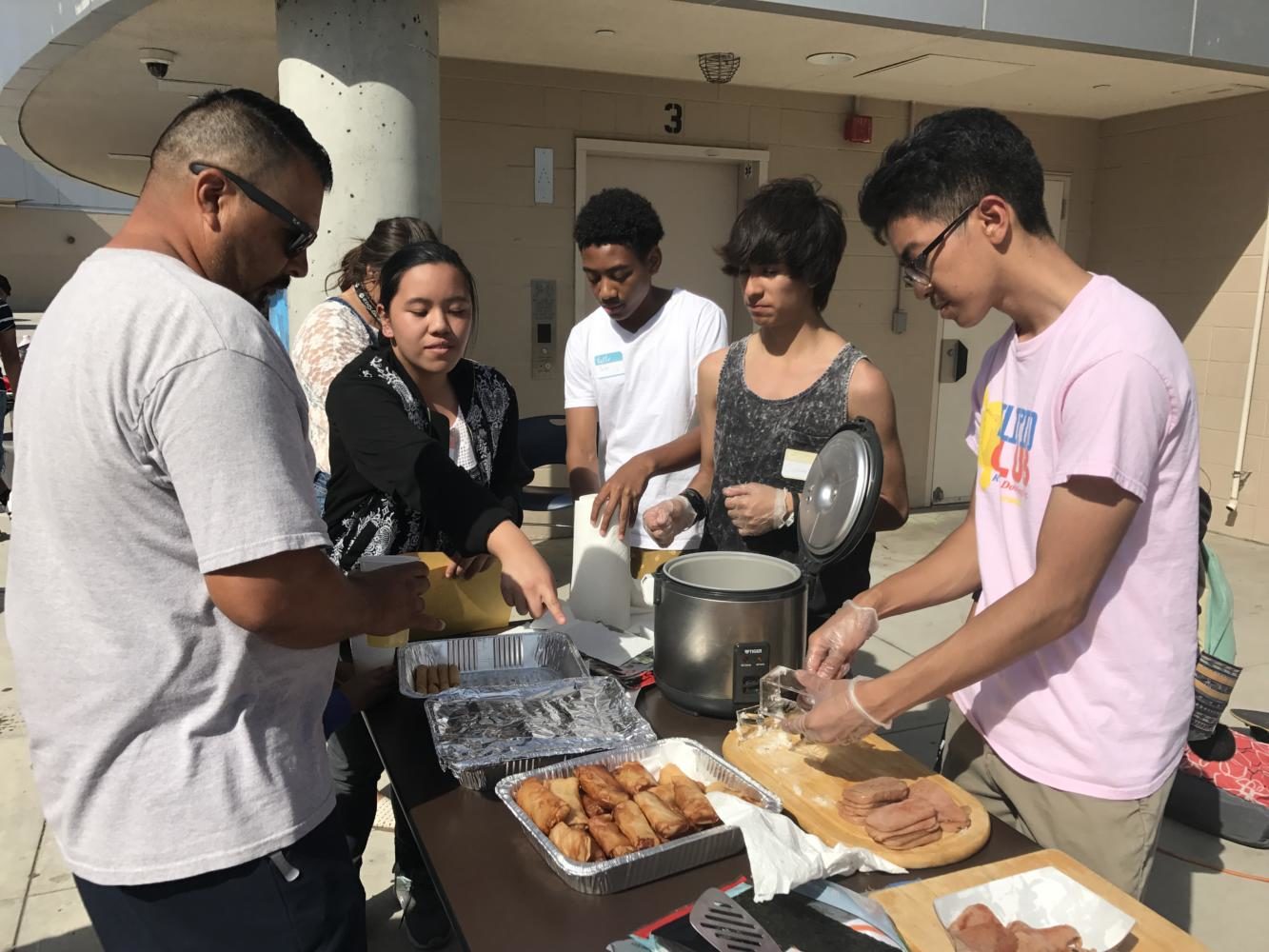 Rancho Dominguez's Filipino Club serving Eggrolls, Spam Musubi, and Turon