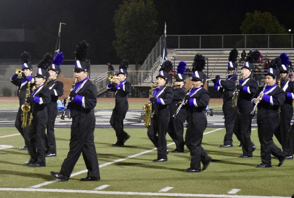 Marching Lobos take the field during halftime of our homecoming football game.